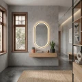 Luksusowy przedpokuj z lustrem owalnym w złotej ramie LED SP29 50x90 cm. Aranżacja wnętrza premium dla projektantów i architektów.